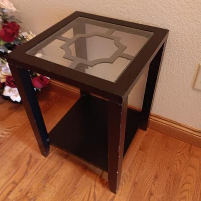 Black framed - glass topped end table with a beautiful bouquet of faux Roses.