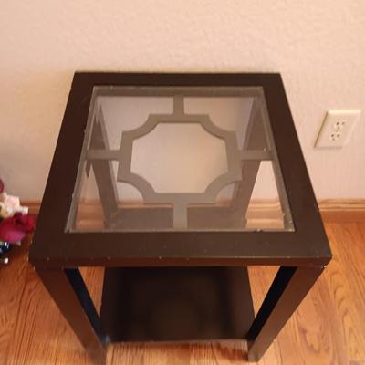 Black framed - glass topped end table with a beautiful bouquet of faux Roses.