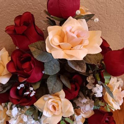 Black framed - glass topped end table with a beautiful bouquet of faux Roses.