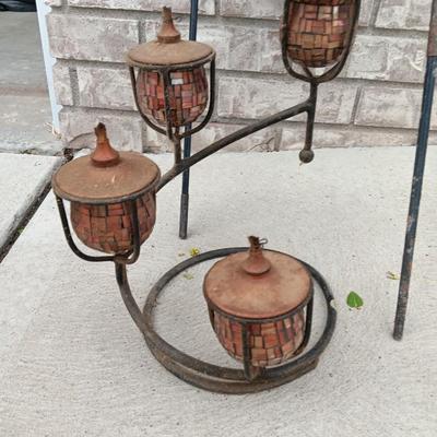 Two hanging mosquito votive lanterns and a 4 Arm Candelabra Oil Lamp on Cast Iron Stand Outdoor Indoor