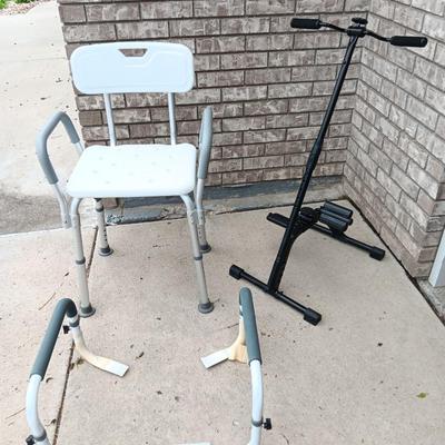 Adjustable height Shower chair with arm and leg exercise pedal and rowing machine.