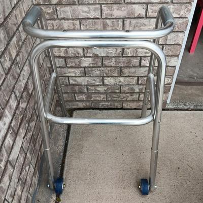 Adjustable height shower chair with adjustable height mobility walker