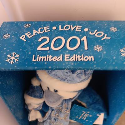 Collectible annual Christmas bear plush and penguin Millennial years.