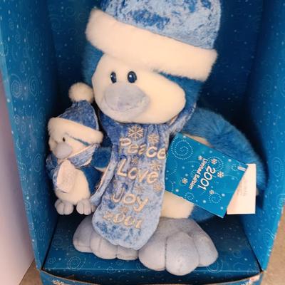 Collectible annual Christmas bear plush and penguin Millennial years.