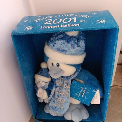 Collectible annual Christmas bear plush and penguin Millennial years.