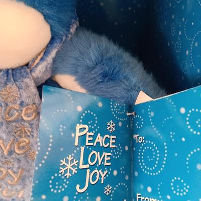 Collectible annual Christmas bear plush and penguin Millennial years.