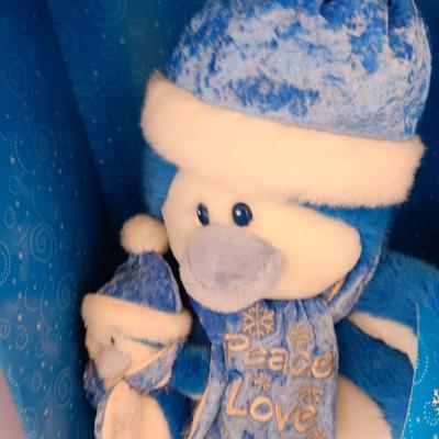 Collectible annual Christmas bear plush and penguin Millennial years.