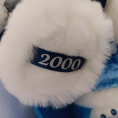 Collectible annual Christmas bear plush and penguin Millennial years.