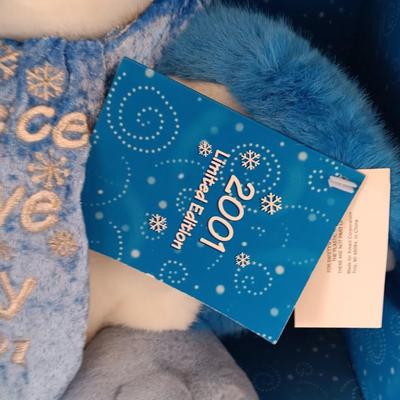 Collectible annual Christmas bear plush and penguin Millennial years.