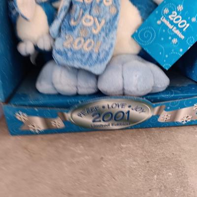 Collectible annual Christmas bear plush and penguin Millennial years.