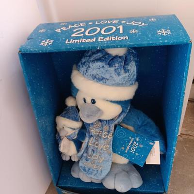 Collectible annual Christmas bear plush and penguin Millennial years.