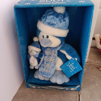 Collectible annual Christmas bear plush and penguin Millennial years.