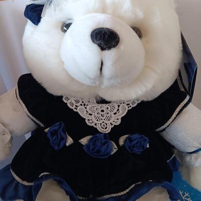 Collectible annual Christmas bear plush and penguin Millennial years.