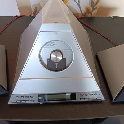 Cool Radio Shack light up am/FM CD / Cassette Clock radio with speakers on a Black media cabinet stand.
