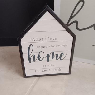 Two Home wall art pictures and a welcome pig
