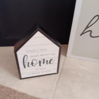Two Home wall art pictures and a welcome pig