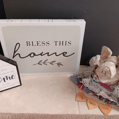 Two Home wall art pictures and a welcome pig