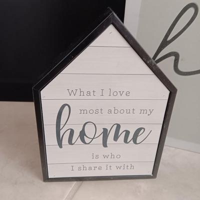 Two Home wall art pictures and a welcome pig