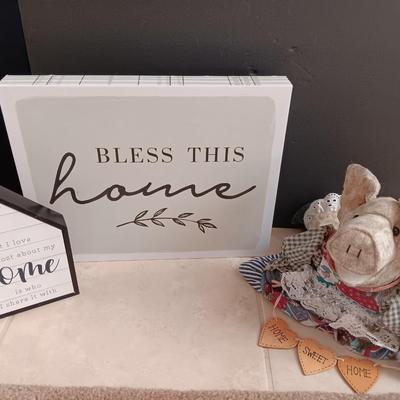Two Home wall art pictures and a welcome pig