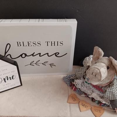 Two Home wall art pictures and a welcome pig