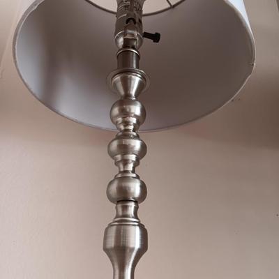 Two matching silver colored electric accent table lamps