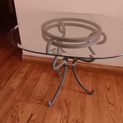 Metal base glass topped end / accent table with faux floral arrangement in a Decorative pot