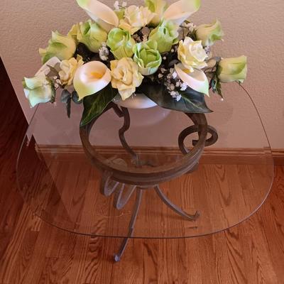 Metal base glass topped end / accent table with faux floral arrangement in a Decorative pot