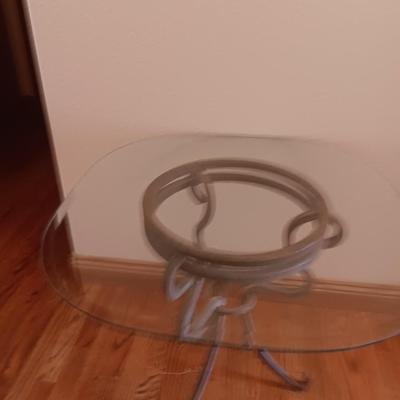 Metal base glass topped end / accent table with faux floral arrangement in a Decorative pot