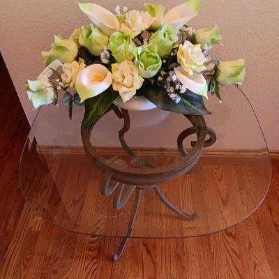 Metal base glass topped end / accent table with faux floral arrangement in a Decorative pot