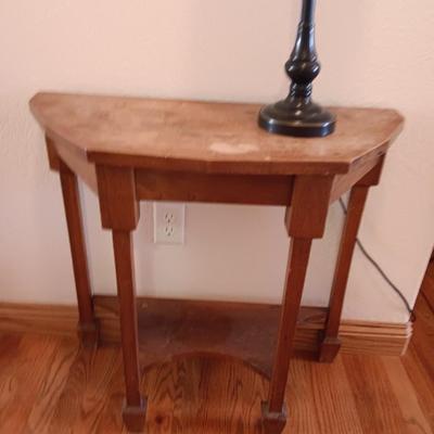 Antique wooden flat backed entry-way table with electric black accent lamp