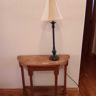 Antique wooden flat backed entry-way table with electric black accent lamp