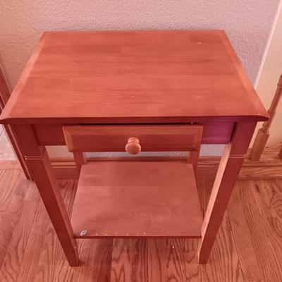 Small wooden accent table with drawer and unique pottery birds in a nest artwork