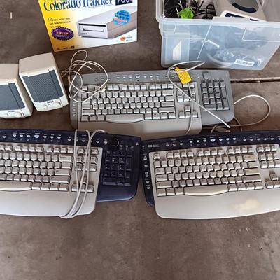 Assortment of computer keyboards and drives and other Computer accessories