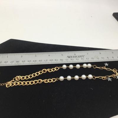 Star and pearls gold toned necklace