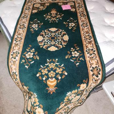 Green wool rug 24 inches by 52 inches