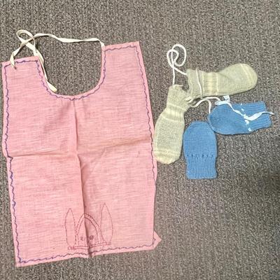 2 pairs of mittens and a bib-doll accessories