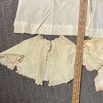 Lot of antique vintage baby doll clothes