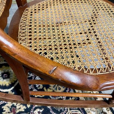 Carved and caned rocking chair
