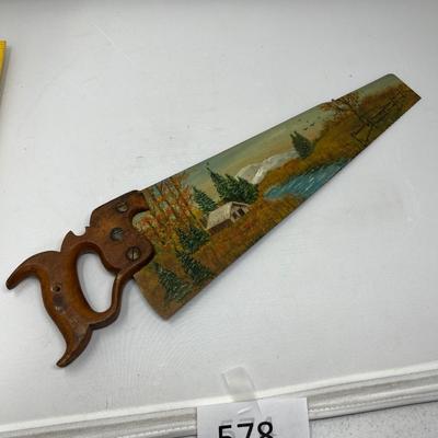 Antique saw with scene painted