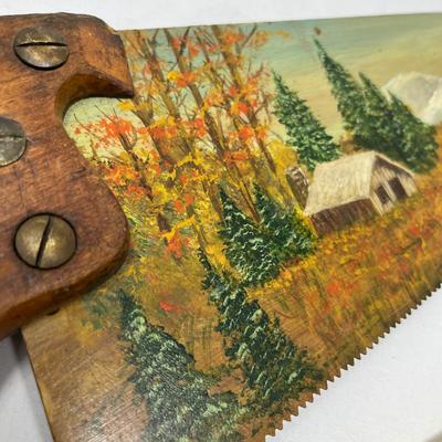 Antique saw with scene painted