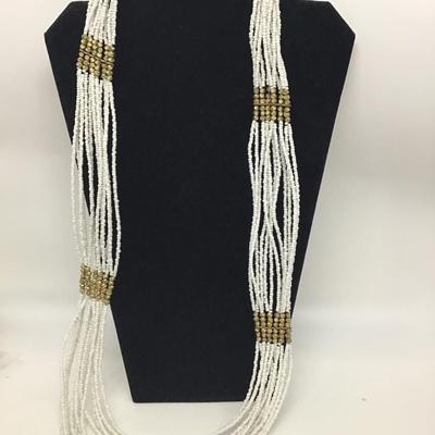 Beautiful White Glass seed bead with Gold Accent throughout. Pretty