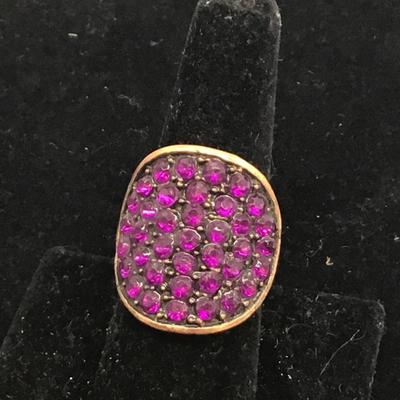 Bronze toned ring with purple rhinestones