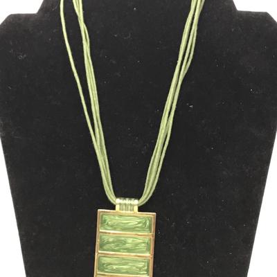 Green pendant on leather mutli stranded necklace