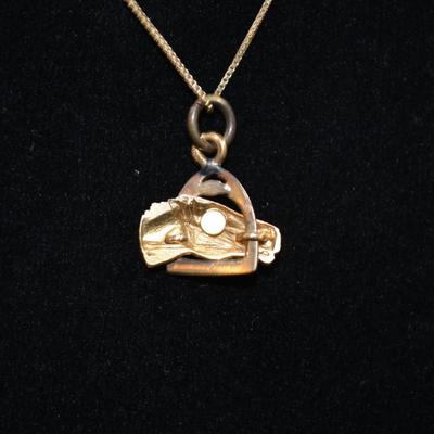 Sale Photo Thumbnail #60: In good condition, no flaws to note. Pendant has no hallmark, and the chain is stamped 14k.