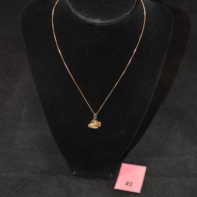 Sale Photo Thumbnail #58: In good condition, no flaws to note. Pendant has no hallmark, and the chain is stamped 14k.