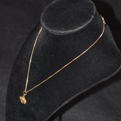 Sale Photo Thumbnail #61: In good condition, no flaws to note. Pendant has no hallmark, and the chain is stamped 14k.