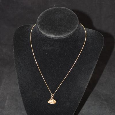 Sale Photo Thumbnail #65: In good condition, no flaws to note. Pendant has no hallmark, and the chain is stamped 14k.