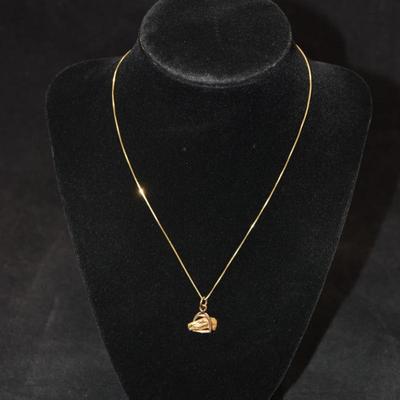Sale Photo Thumbnail #57: In good condition, no flaws to note. Pendant has no hallmark, and the chain is stamped 14k.
