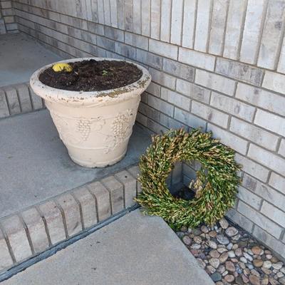 A LARGE LIGHTER WEIGHT PLANTER AND FAUX FOLIAGE WREATH