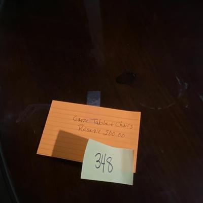 Vintage Round Game Table with Four Captains Chairs